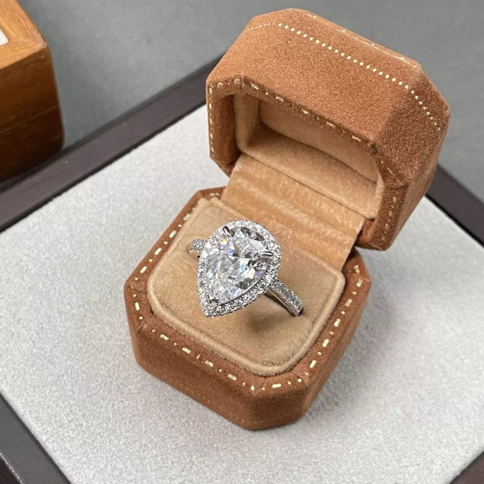 4 carat teardrop moissanite ring crafted in 925 sterling silver with a brilliant sparkling gemstone.