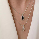 925 sterling silver geometric pendant necklace featuring a natural agate stone with an elegant modern design.