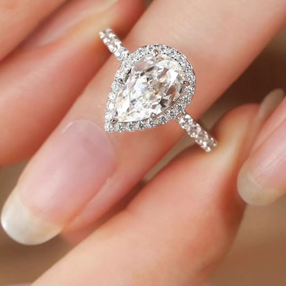 4 carat teardrop moissanite ring crafted in 925 sterling silver with a brilliant sparkling gemstone.