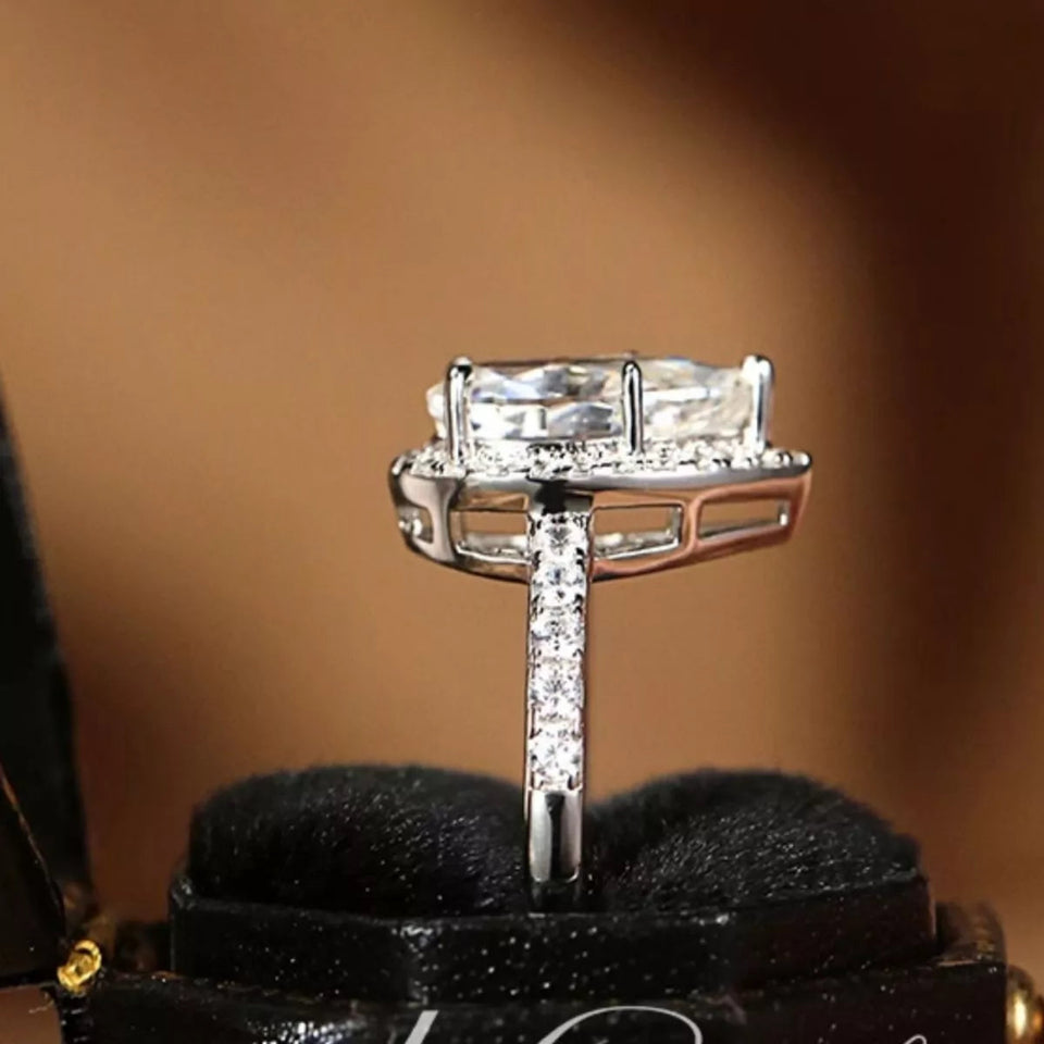4 carat teardrop moissanite ring crafted in 925 sterling silver with a brilliant sparkling gemstone.