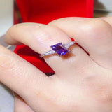 1 carat purple rectangle moissanite ring with a platinum-plated finish and brilliant sparkling gemstone.