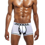 Male model wearing blue extended ice silk sports boxer briefs.