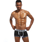 Male model wearing blue extended ice silk sports boxer briefs.
