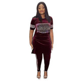 Woman wearing an elegant African print two-piece skirt set in a stylish traditional-inspired design.