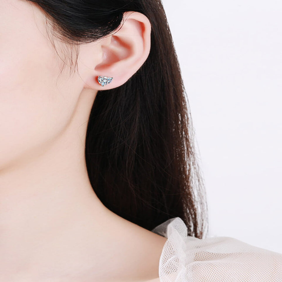 2 carat heart-shaped moissanite stud earrings with brilliant sparkling gemstones.
