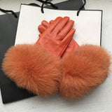 Women's genuine leather winter gloves with soft fox fur cuffs and warm wool lining for elegant cold-weather wear.