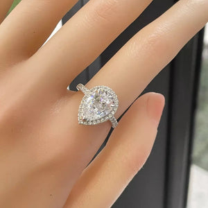 4 carat teardrop moissanite ring crafted in 925 sterling silver with a brilliant sparkling gemstone.