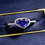 2 carat heart-shaped moissanite ring with sparkling side stones and brilliant shine.