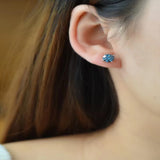 2 carat moissanite four-prong platinum-plated ring with a brilliant sparkling gemstone.