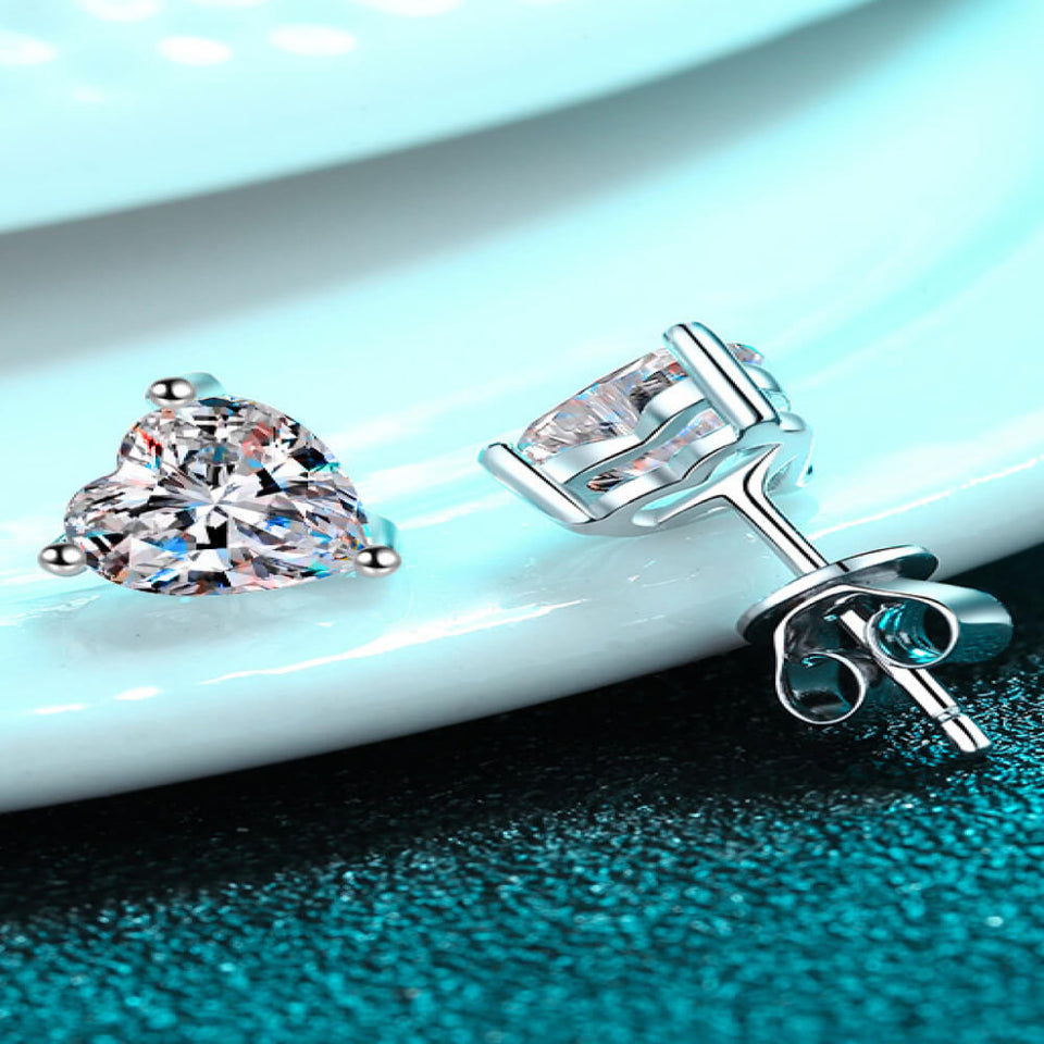 2 carat heart-shaped moissanite stud earrings with brilliant sparkling gemstones.