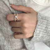 925 sterling silver knot ring featuring an elegant intertwined design.