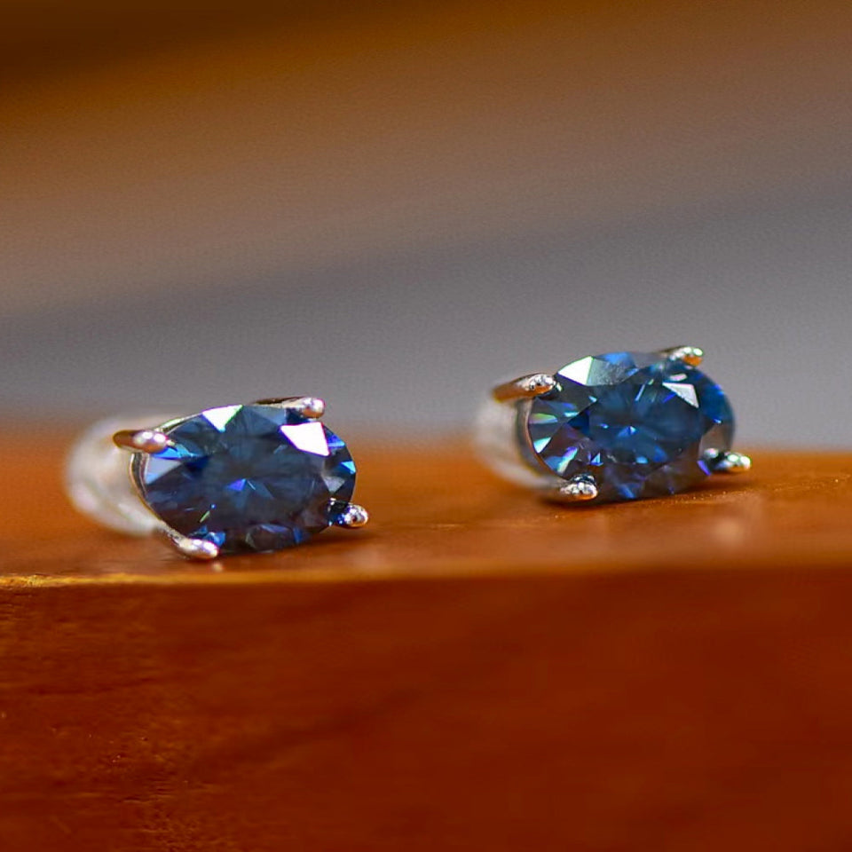 2 carat moissanite four-prong platinum-plated ring with a brilliant sparkling gemstone.