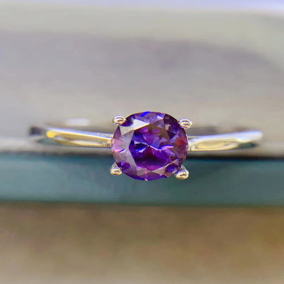 1 carat moissanite solitaire ring with a classic four-prong setting and brilliant sparkling gemstone.
