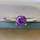 1 carat moissanite solitaire ring with a classic four-prong setting and brilliant sparkling gemstone.
