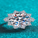 10 carat flower-shaped moissanite ring with brilliant sparkling gemstones.