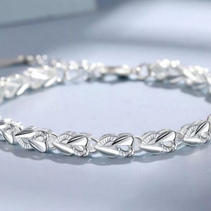 925 sterling silver heart link bracelet with elegant polished heart-shaped links.