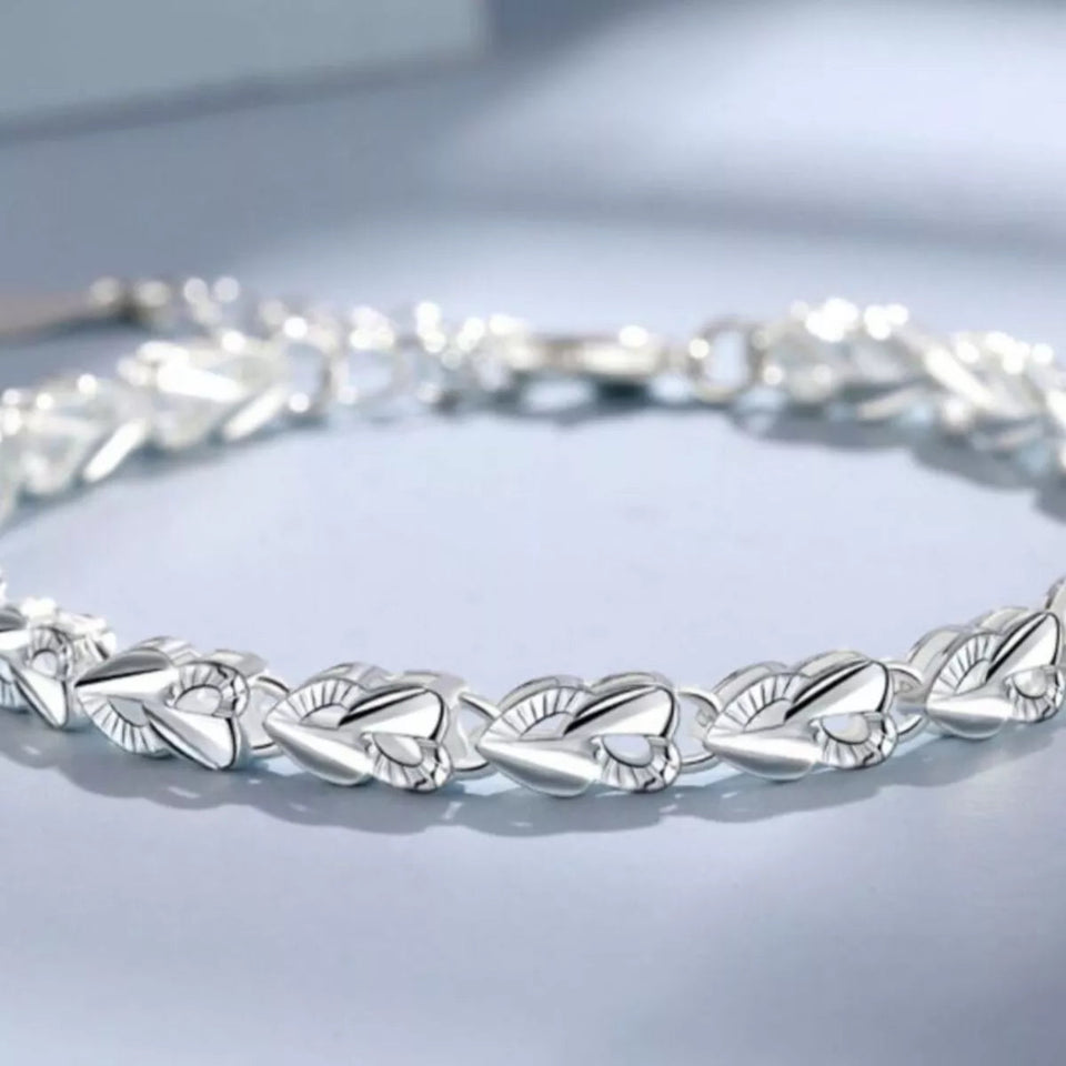 925 sterling silver heart link bracelet with elegant polished heart-shaped links.