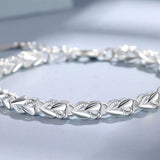 925 sterling silver heart link bracelet with elegant polished heart-shaped links.