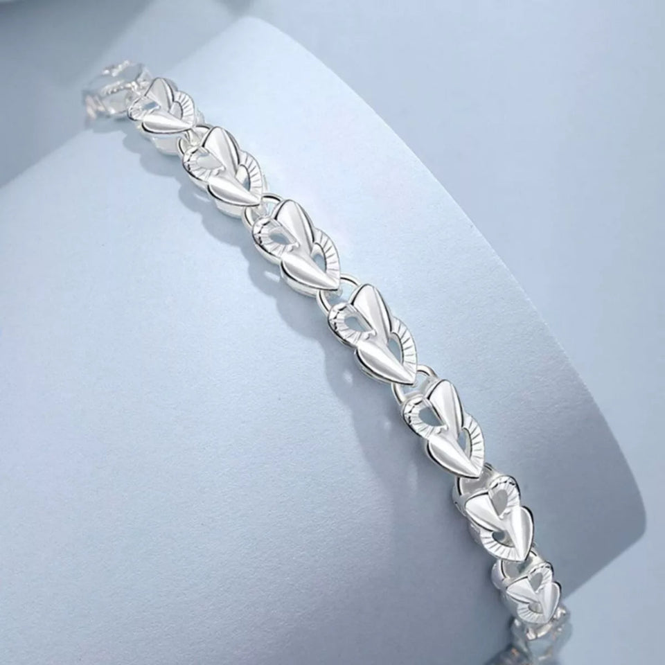 925 sterling silver heart link bracelet with elegant polished heart-shaped links.