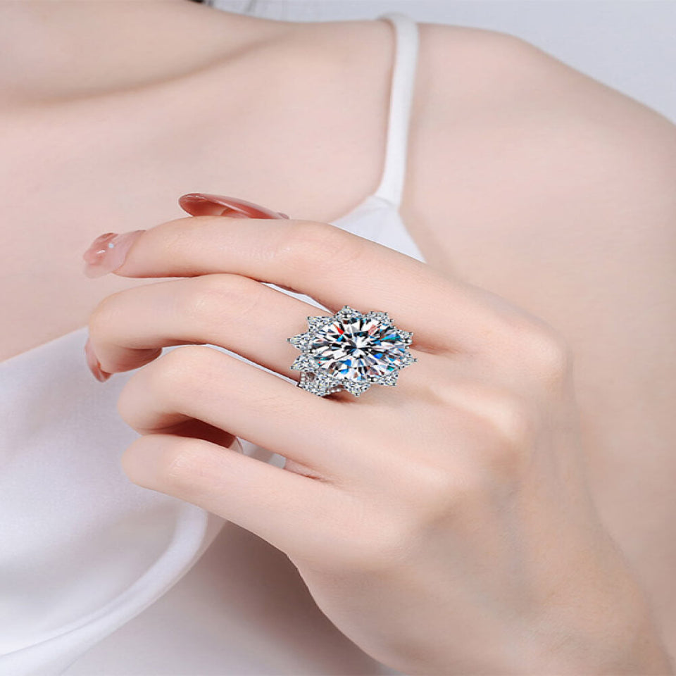 10 carat flower-shaped moissanite ring with brilliant sparkling gemstones.