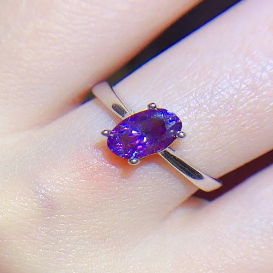 1 carat moissanite solitaire ring with a classic four-prong setting and brilliant sparkling gemstone.