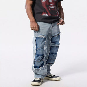 Men's distressed patchwork denim jeans with a relaxed everyday fit.