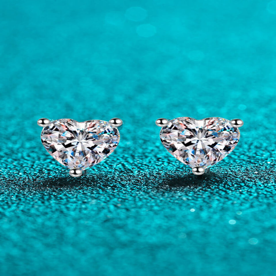 2 carat heart-shaped moissanite stud earrings with brilliant sparkling gemstones.