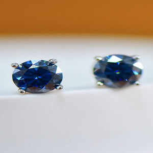 2 carat moissanite four-prong platinum-plated ring with a brilliant sparkling gemstone.
