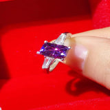 1 carat purple rectangle moissanite ring with a platinum-plated finish and brilliant sparkling gemstone.