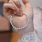 925 sterling silver beaded bracelet with a classic polished bead design.