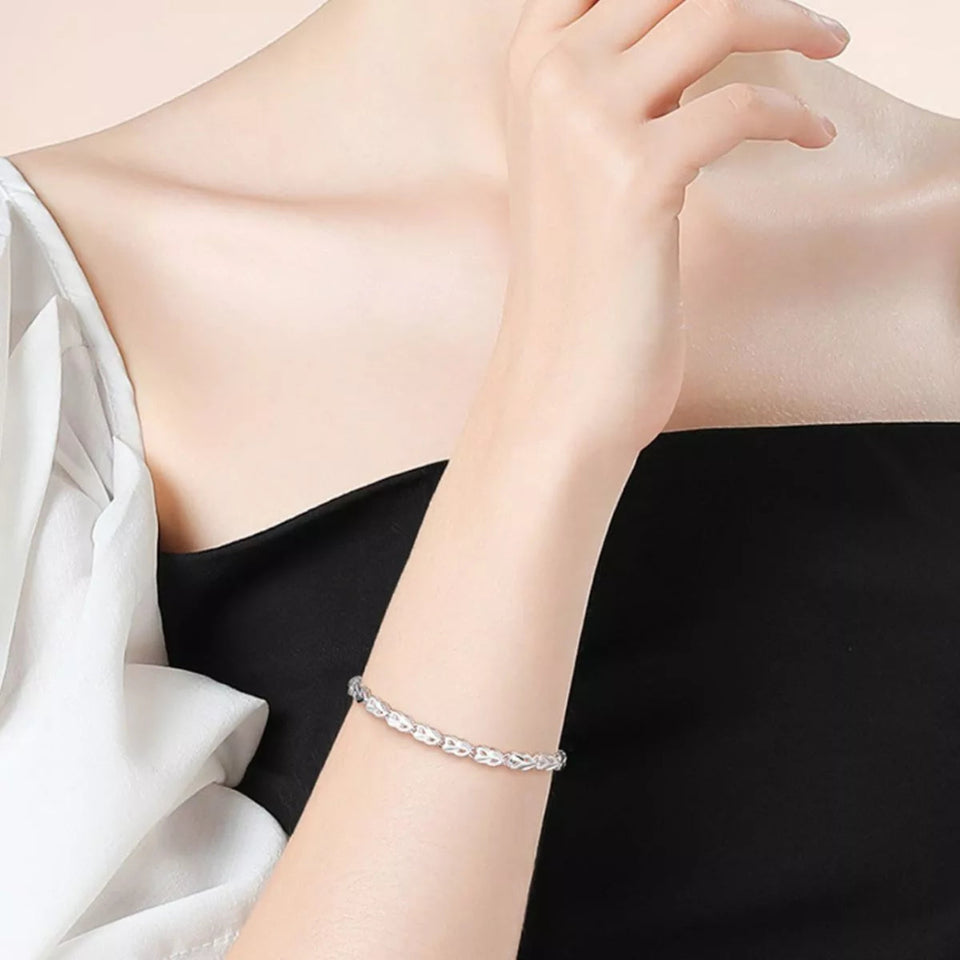 925 sterling silver heart link bracelet with elegant polished heart-shaped links.