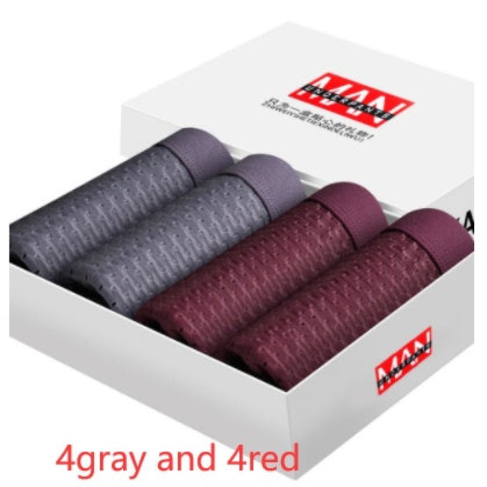 Four-pack men's boxer briefs in assorted colors.