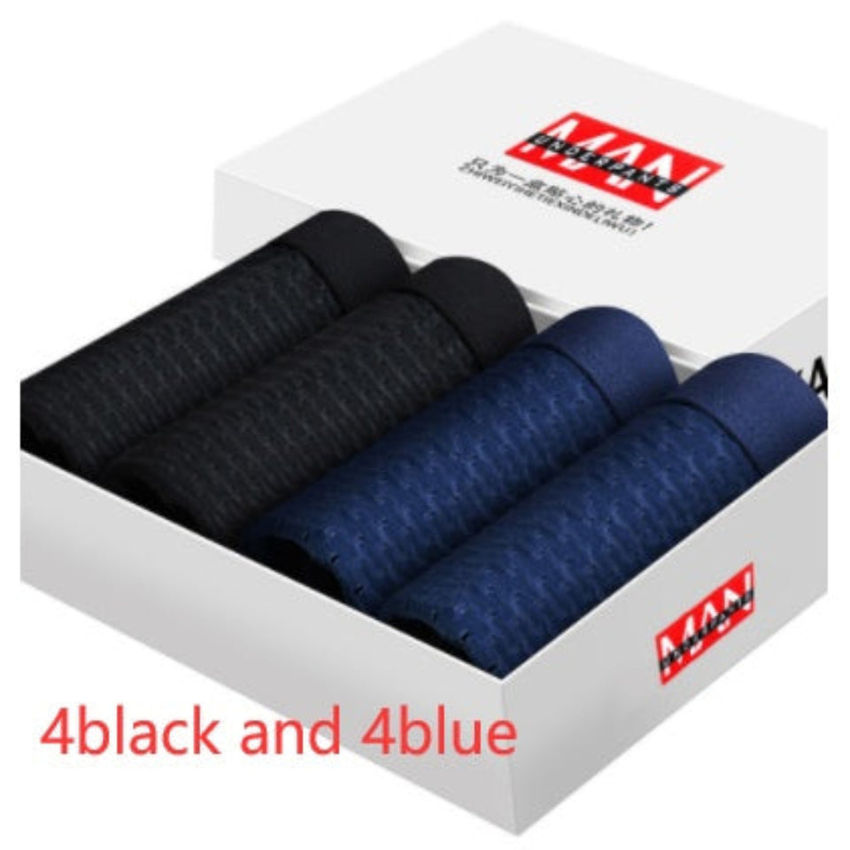Four-pack men's boxer briefs in assorted colors.