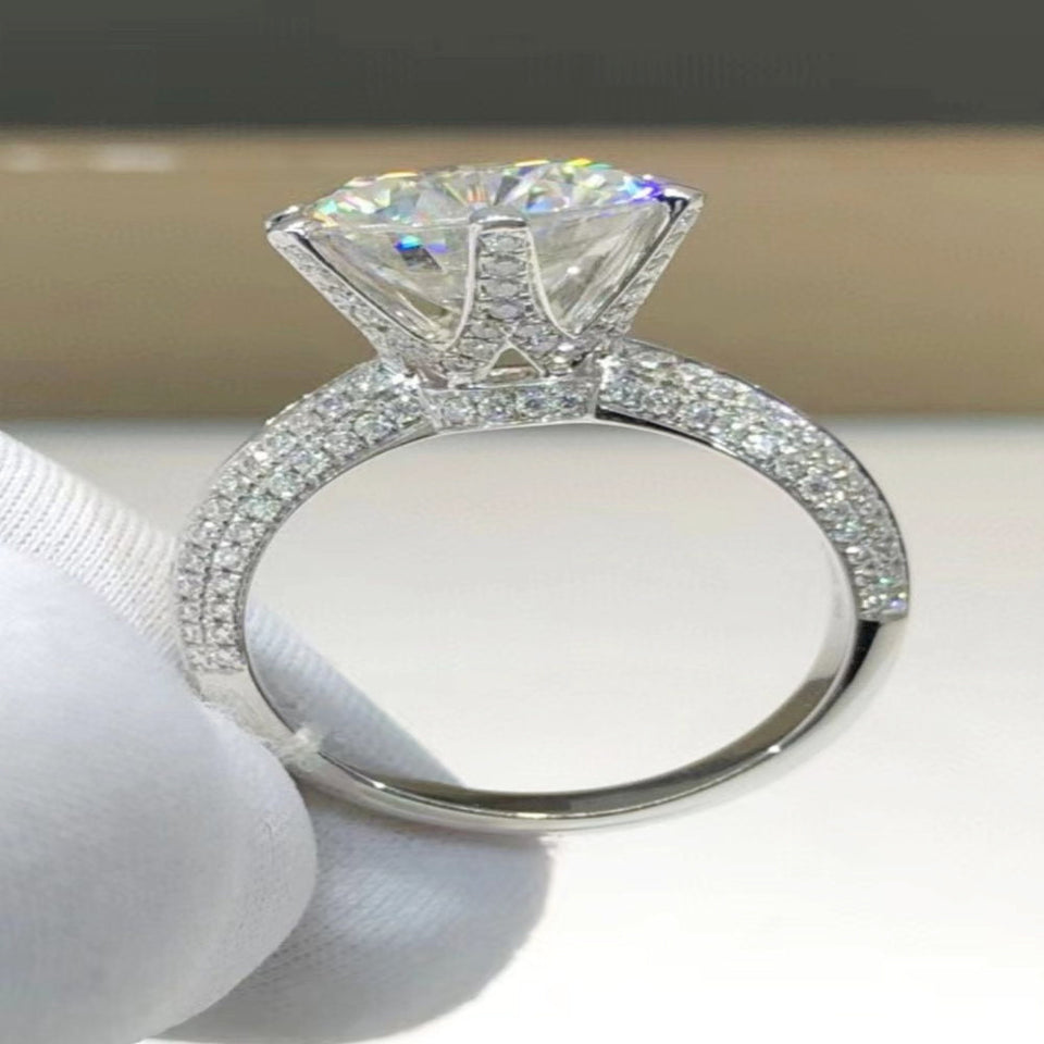 5 carat moissanite ring featuring a secure six-prong setting with a brilliant sparkling gemstone.
