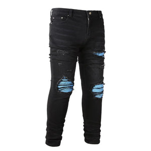 Men's distressed skinny denim jeans with a modern fitted silhouette.