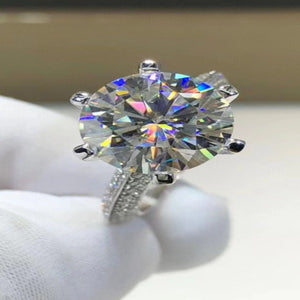 5 carat moissanite ring featuring a secure six-prong setting with a brilliant sparkling gemstone.