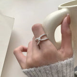 925 sterling silver knot ring featuring an elegant intertwined design.