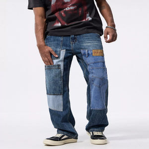 Men's patchwork relaxed fit denim jeans with a casual modern style.