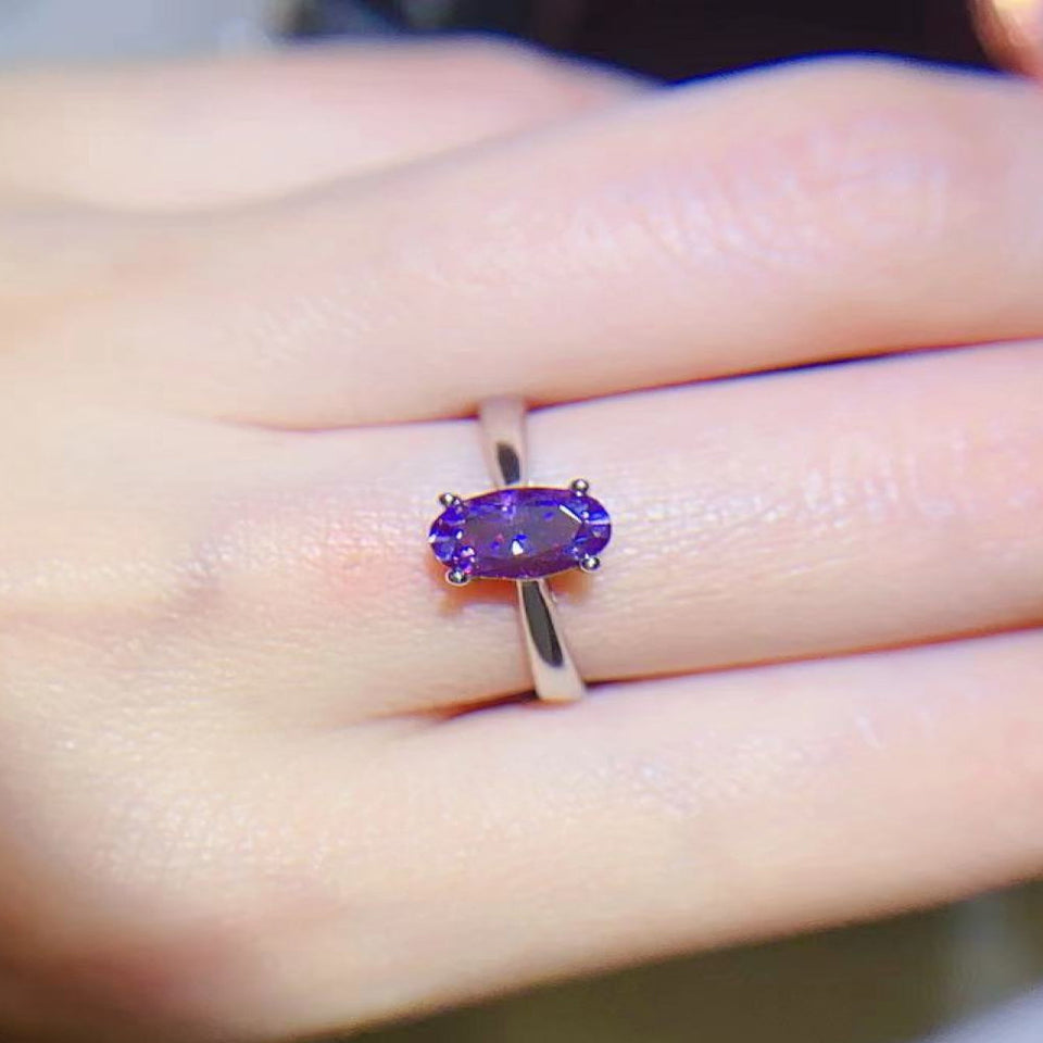 1 carat moissanite solitaire ring with a classic four-prong setting and brilliant sparkling gemstone.